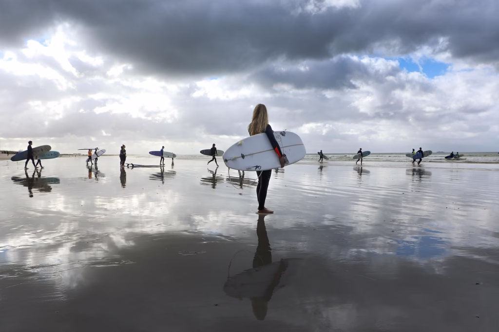 girl holding surboard before lesson in bali