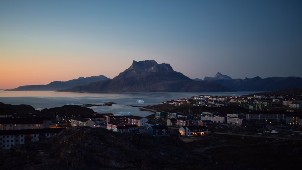 View of Nuuk Greenland with icebergs as the sun sets