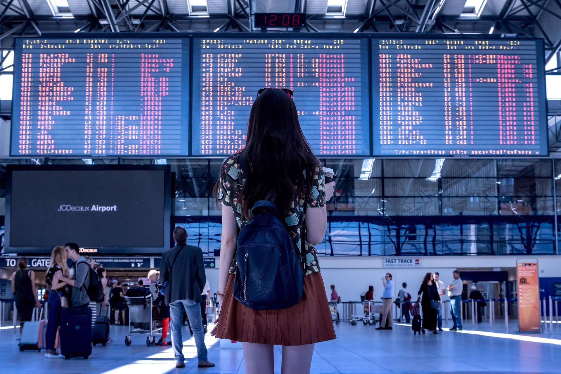 flight canceled flight canceled and girl looking at flight board